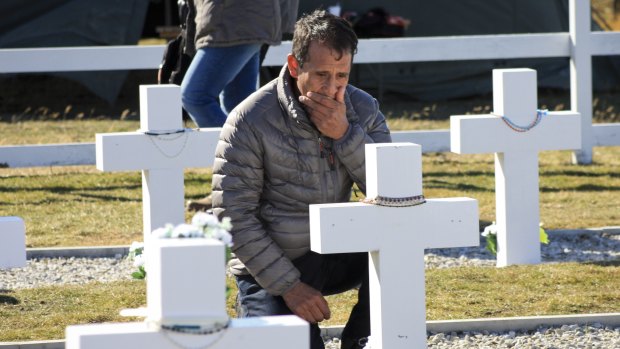 he relative of an Argentinian soldier visits the Darwin Military Cemetery on Falkland, or Malvinas Islands, after the tombs were finally named.