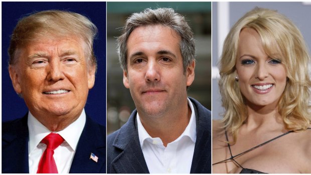 President Donald Trump has changed his story about a payment his attorney Michael Cohen (centre) made to porn star Stormy Daniels (right). 