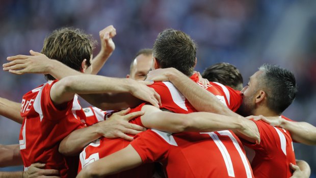 Russia's team players celebrate during the win over Egypt.