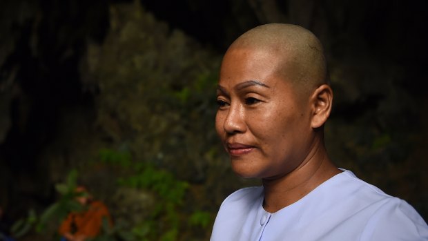 Buddhist nun Dao in the Tham Pra cave shrine where people are praying for the safe return of the trapped 13. 