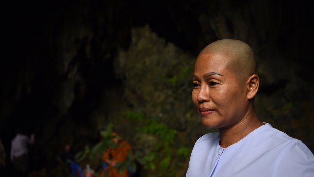 Buddhist nun Dao in the Tham Pra cave shrine where people are praying for the safe return of the trapped 13. 