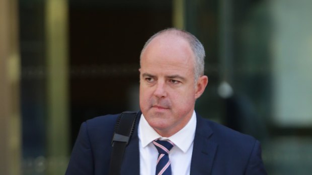 Suncorp executive David Carter leaves the royal commission. 