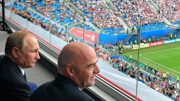 Russian President Vladimir Putin, left, and FIFA President Gianni Infantino before the Confederations Cup, Group A soccer match between Russia and New Zealand, at the St. Petersburg Stadium, in St. Petersburg, Russia last year.