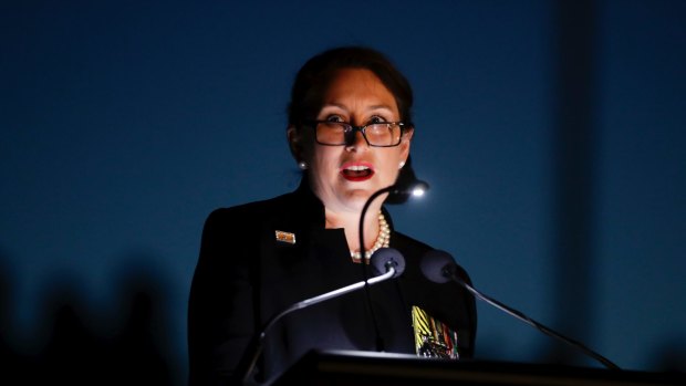 Retired Colonel Susan Neuhaus delivers the address during the Anzac Day dawn service at the Australian War Memorial in Canberra.