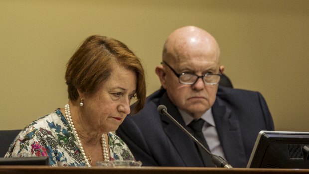 Deputy Chief Magistrate Jelena Popovic looks at the accused's file while journalist John Silvester looks like a hanging judge.  