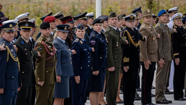 Military personnel from member states stand to attention during the NATO summit at the military and political alliance's headquarters in Brussels, Belgium.