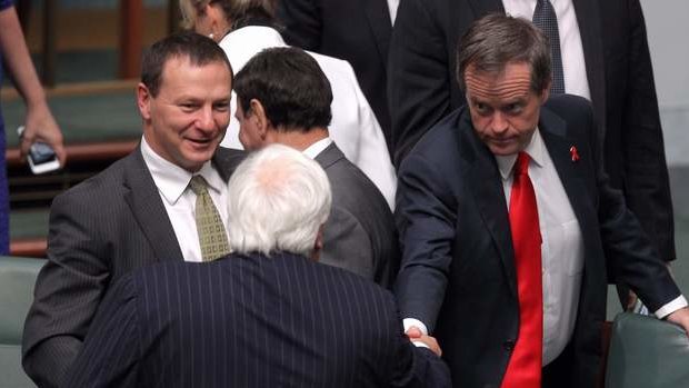 Member for Fairfax Clive Palmer is congratulated by Opposition Leader Bill Shorten after delivering his maiden speech. Photo: Alex Ellinghausen