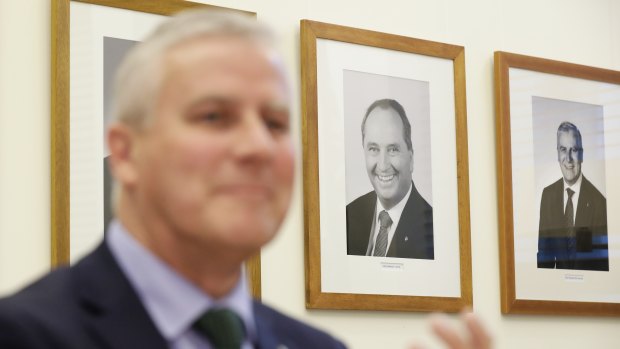 A portrait of former Nationals leader Barnaby Joyce hangs on the wall behind the new Deputy Prime Minister, Michael McCormack. 