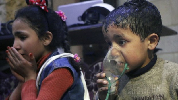 This image, released early on Sunday by the Syrian Civil Defence White Helmets, shows a child receiving oxygen through a respirator following an alleged poison gas attack in the rebel-held town of Douma.