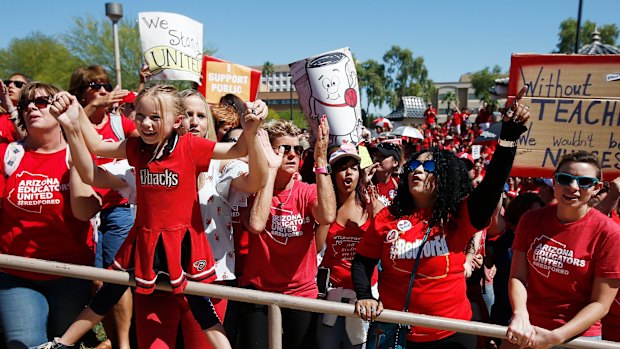 Teachers crowd the lobby of the Arizona Senate as Arizona legislature debates the budget.