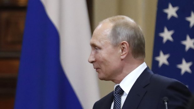 Who has the upper hand here? Donald Trump shakes hand with Vladimir Putin 