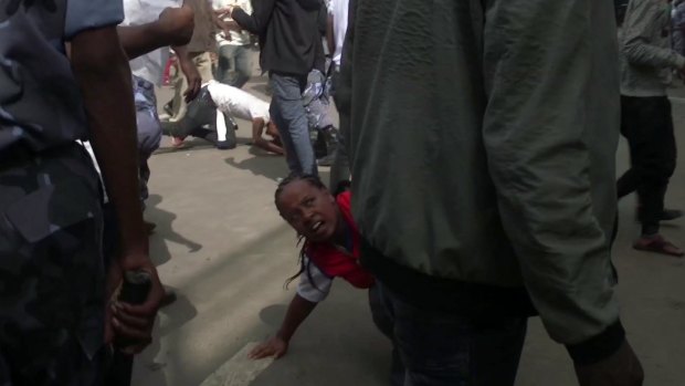People fall over in the rush to get away, after an explosion at a rally for Ethiopia's new Prime Minister, in Addis Ababa on Saturday.