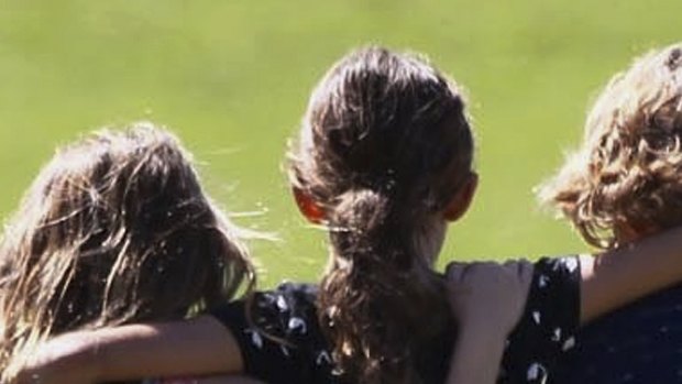 Children console each other after the shooting at Marjory Stoneman Douglas High.