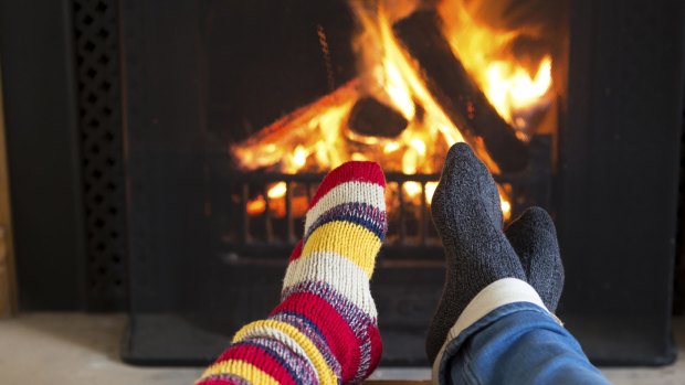 Think of creative ways to keep warm: wear woolly socks and snuggle in front of the fire.