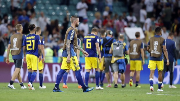 Sweden players walk off the pitch  after their last-minute loss to Germany.