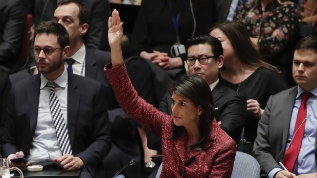 United States Ambassador to the United Nations Nikki Haley votes against a draft resolution presented by Russia during a Security Council meeting.