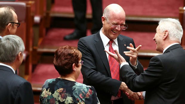 LDP Senator David Leyonhjelm is congratulated by Senator Doug Cameron after delivering his maiden speech. Photo: Alex Ellinghausen