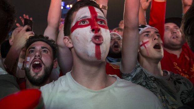 England fans react to the match between Colombia and England.
