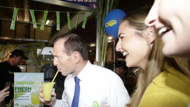 Opposition leader Tony Abbott and his daughters visit the Ekka during his visit to Brisbane on Friday.