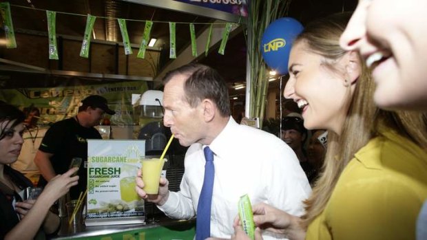 Opposition leader Tony Abbott and his daughters visit the Ekka during his visit to Brisbane on Friday.