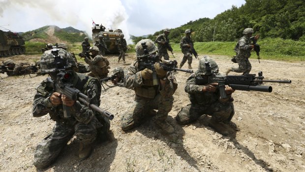 South Korean and U.S. marines aim their machine guns during a joint military exercise in Pohang, South Korea in 2016.