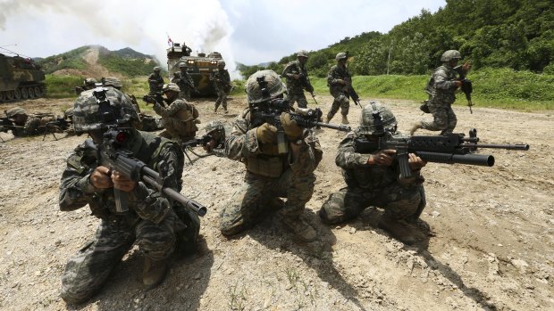 South Korean and U.S. marines aim their machine guns during a joint military exercise in Pohang, South Korea in 2016.