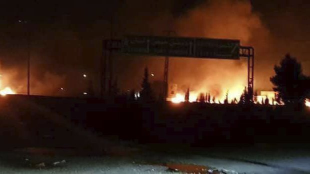 Flames rising after an attack in an area known to have numerous Syrian army military bases, in Kisweh, south of Damascus, Syria. Syrian state-run media said Israel struck a military outpost.