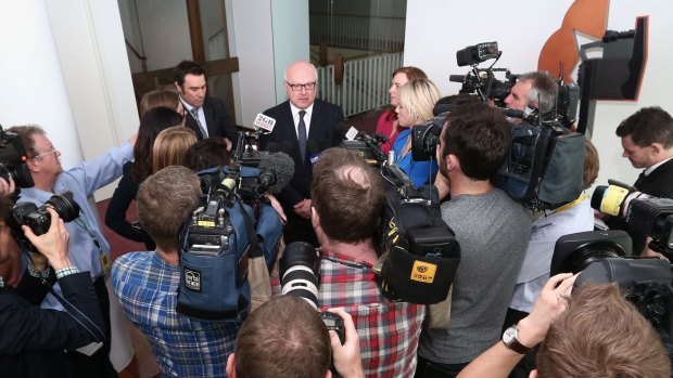 Attorney-General Senator George Brandis addresses the media in the press gallery on Thursday.