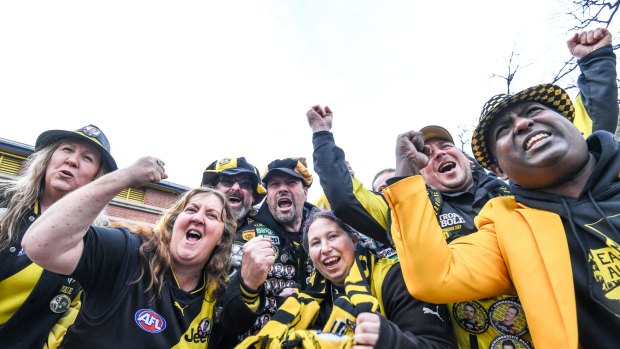 Members of the Richmond cheer squad getting into the Grand final fever at Punt Road.