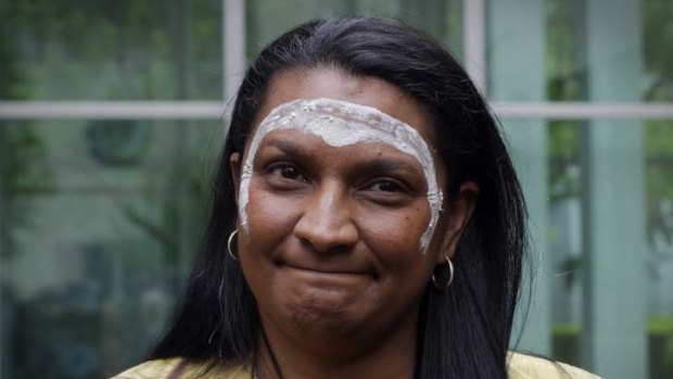 Northern Territory Senator Nova Peris was painted by traditional owner Eric Fejo during an Indigenious blessing ceremony before she made her first speech at Parliament House. Photo: Andrew Meares