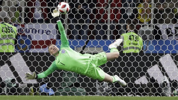 Hero: England goalkeeper Jordan Pickford saves a penalty. 