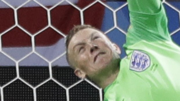 Hero: England goalkeeper Jordan Pickford saves a penalty. 