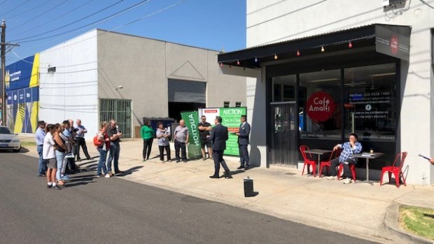 The warehouse and cafe at 5-7 Victory Road in Airport West sold after a tight bidding at auction for $972,000.