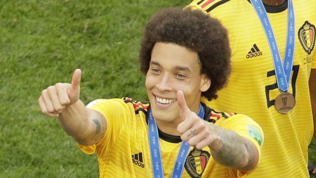All smiles: Belgium's Axel Witsel gestures to fans after the win.