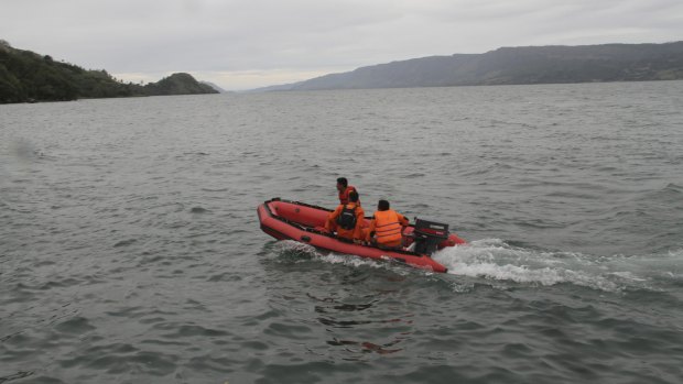 An Indonesian search and rescue team searches for survivors.