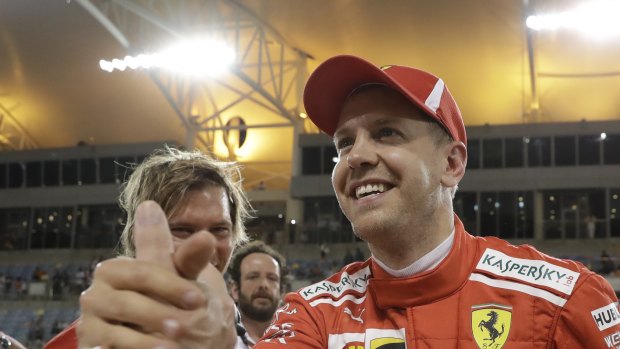 Ferrari's Sebastian Vettel celebrates his win in the Bahrain Grand Prix.