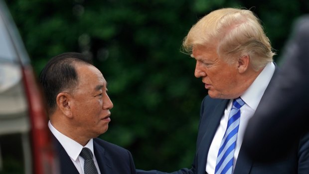 President Donald Trump talks with Kim Yong Chol, left, former North Korean military intelligence chief and one of leader Kim Jong Un's closest aides.