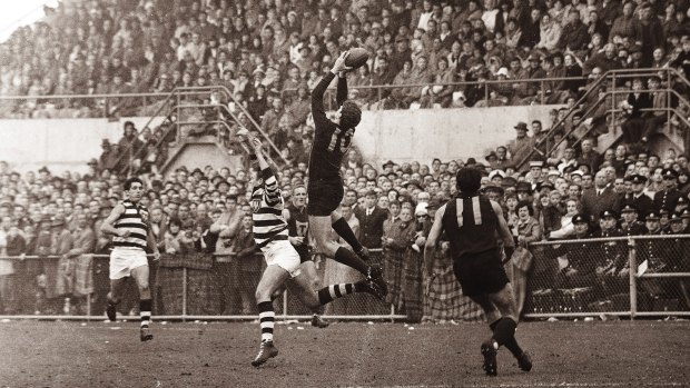 A high-flying Peter Hudson in action during a golden era of the game in Hobart.