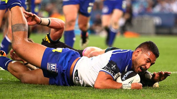 Clincher: Krisnan Inu drove his way over the line for the Bulldogs.