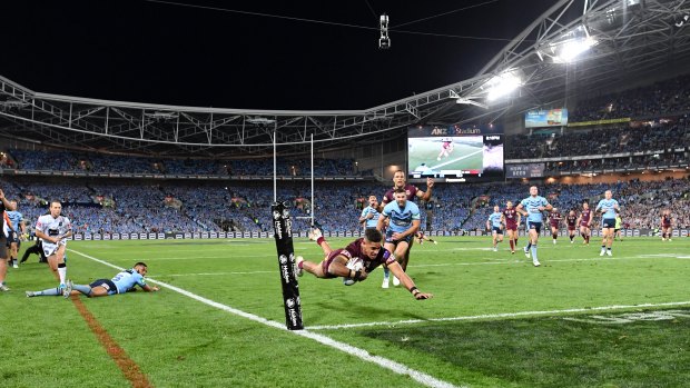 Dane Gagai flies over for a try for Queensland moments after being denied by the bunker.