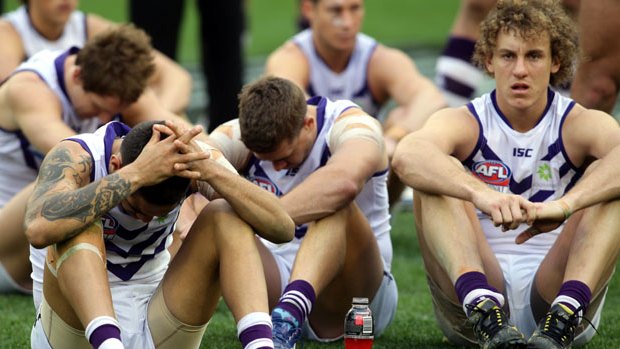 AFL Grand Final 2013 MCG, Dejected Fremantle Dockers at the MCG. 28th September 2013 The Age Sport, Photo by Jason South.