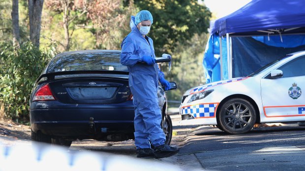 Police attend a crime scene where the man died from stab wounds at Murrumba Downs.