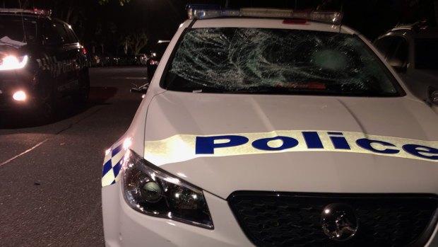 One of the four police cars damaged by partygoers.