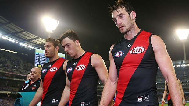 All over: Tom Bellchambers, Michael Hibberd and Jobe Watson  walk off after the defeat.