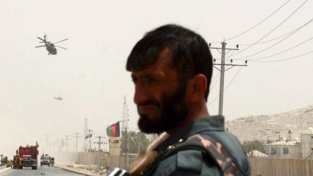 An Afghan policeman stands guard in Kandahar southern of Kabul, Afghanistan.