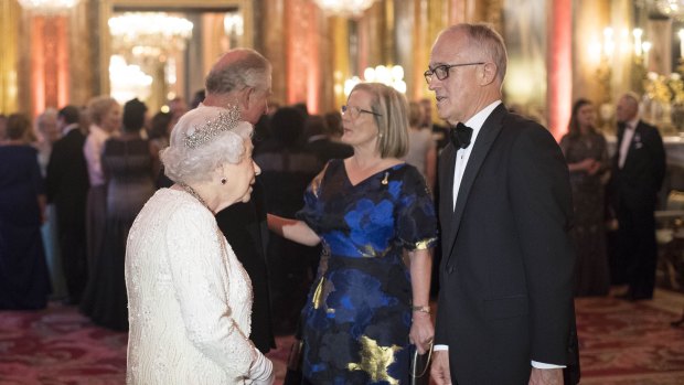Britain's Queen Elizabeth II and Prince Charles greet Australia's Prime Minister Malcolm Turnbull and his wife Lucy in the Blue Drawing Room at Buckingham Palace as the Queen hosts a dinner during the Commonwealth Heads of Government Meeting, in London, April 2018.