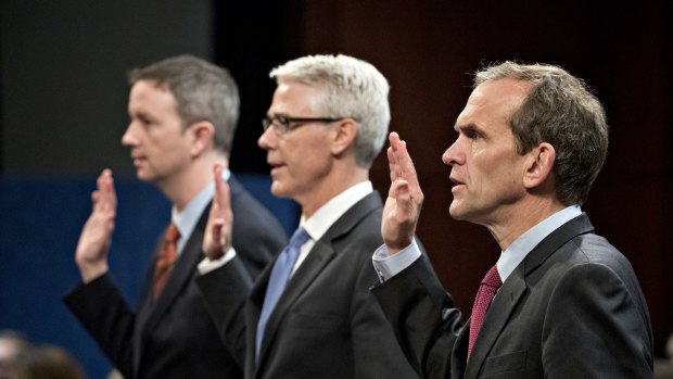 Kent Walker, vice president and general counsel with Google Inc., right, swears with other tech executives in to a House Intelligence Committee hearing in Washington,