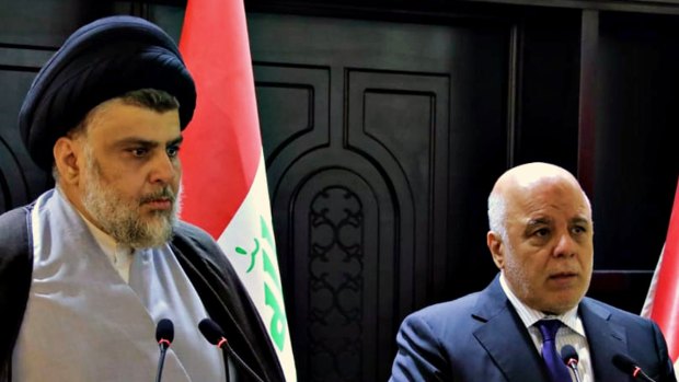 Iraqi Prime Minister Haider al-Abadi, right, and Shiite cleric Muqtada al-Sadr hold a press conference in the heavily fortified Green Zone in Baghdad, Iraq, in May.