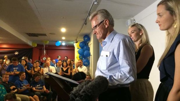Bill Glasson addresses supporters at the Morningside AFL club.
