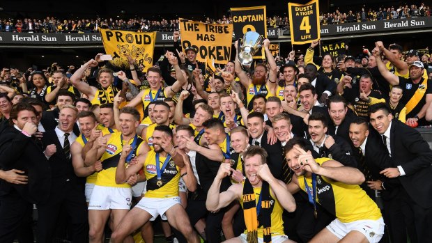 The Tigers celebrate their grand final win in 2017. 